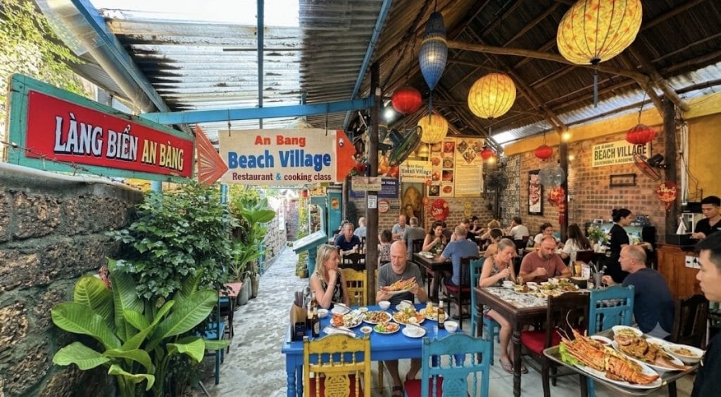 Cozy lantern-lit dining atmosphere at An Bang Beach Village Restaurant in the heart of An Bang Fishing Village, Hoi An