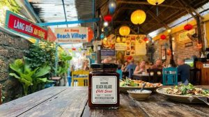 Homemade vegan An Bang Beach Village Chilli Sauce on a wooden table at An Bang Beach Village Restaurant in An Bang Fishing Village, Hoi An